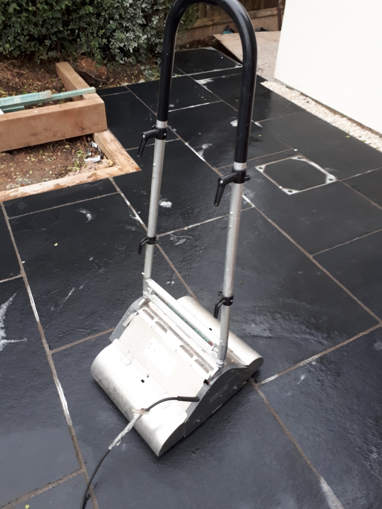 Acid Damaged Black Limestone Patio During Cleaning With CRB Machine Bromsgrove